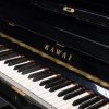 polished black kawai K-6 upright piano keyboard