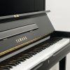 Yamaha Mode UX1 upright piano in polished black