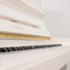 Yamaha P121 upright piano in polished white
