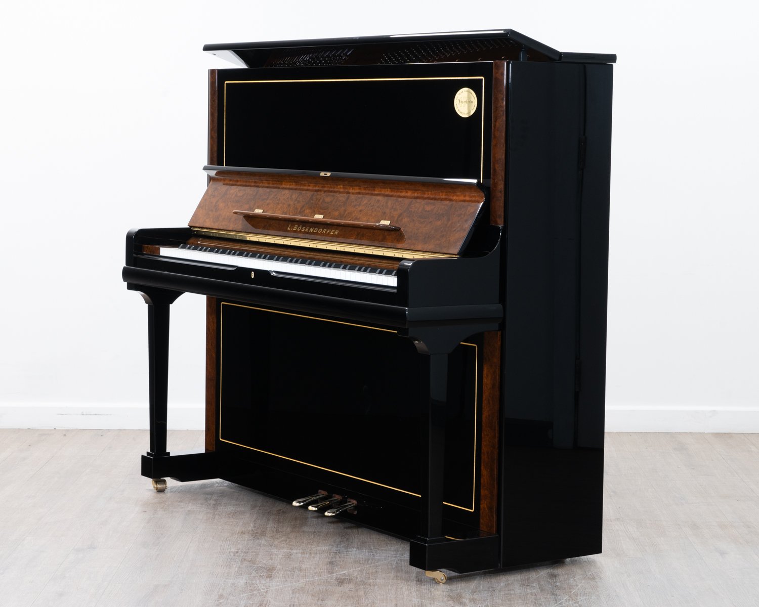 Bosendorfer 130 upright piano in polished black with burr walnut
