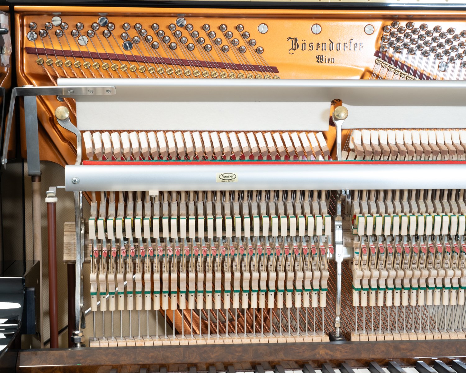 Bosendorfer 130 upright piano in polished black with burr walnut