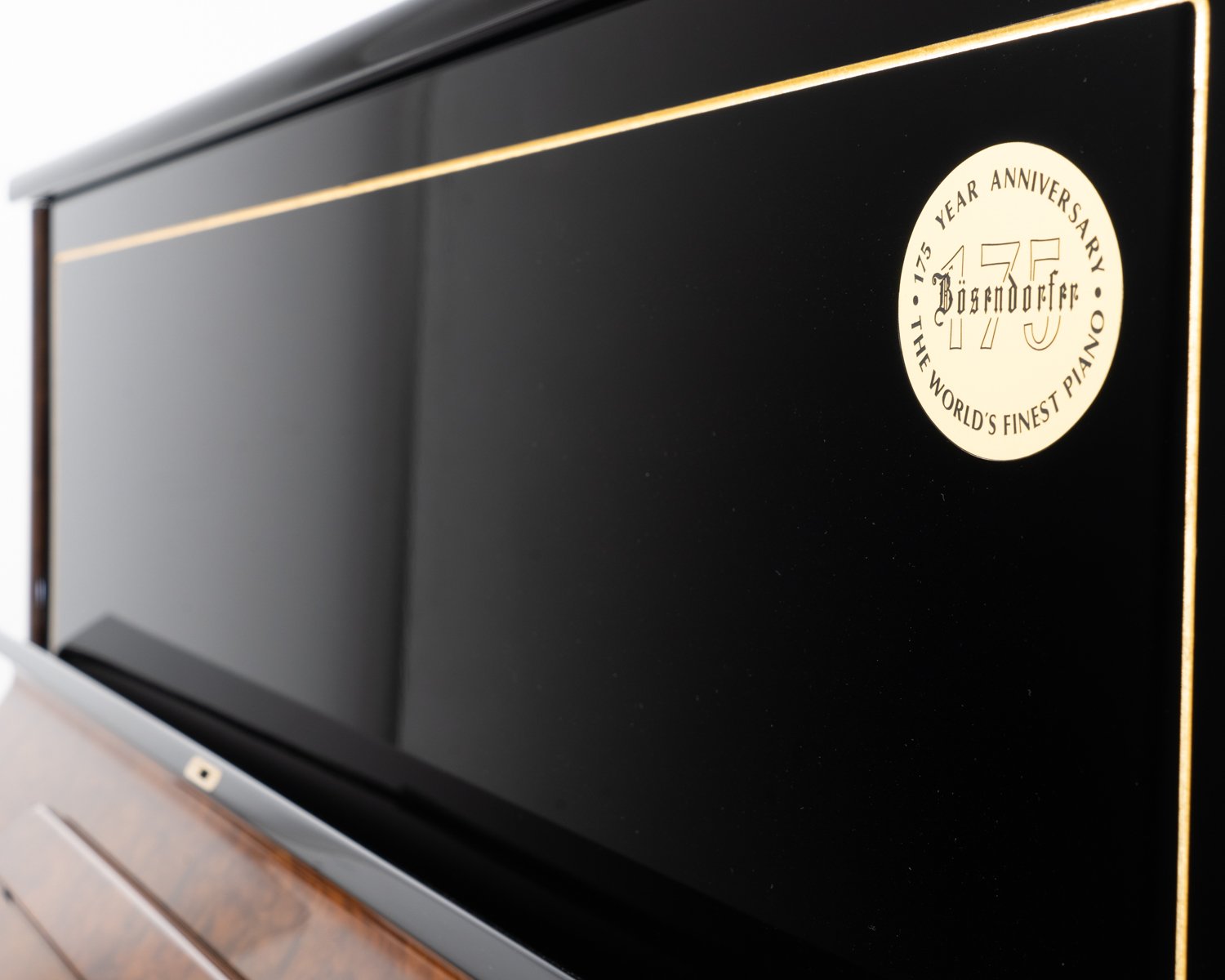 Bosendorfer 130 upright piano in polished black with burr walnut