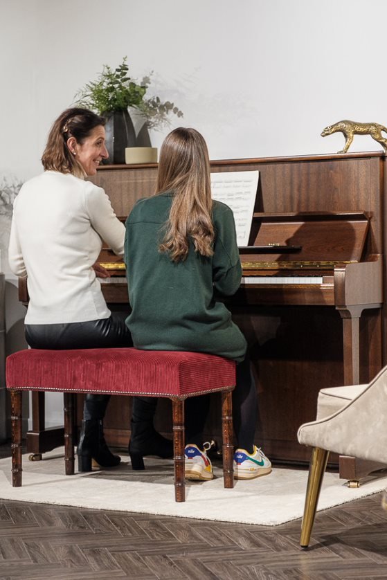 Family playing Yamaha upright piano together